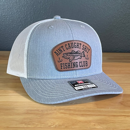 Ain't Caught Shit Fishing Club Leather Patch Trucker Hat. Richardson 112.
