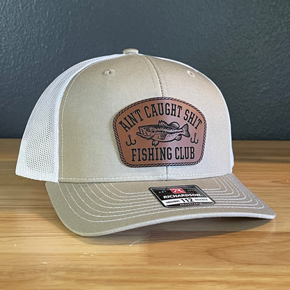 Ain't Caught Shit Fishing Club Leather Patch Trucker Hat. Richardson 112.