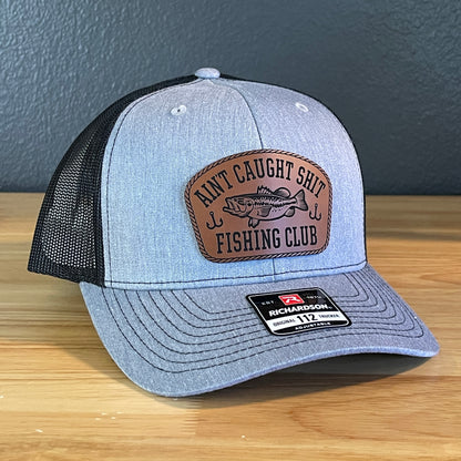 Ain't Caught Shit Fishing Club Leather Patch Trucker Hat. Richardson 112.