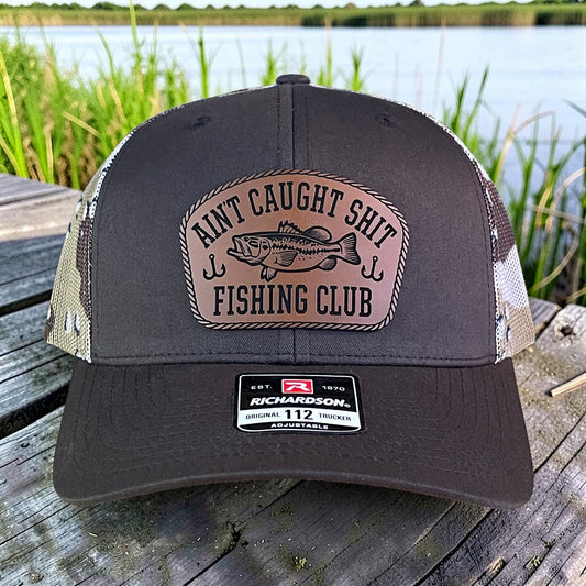 Ain't Caught Shit Fishing Club Trucker Hat