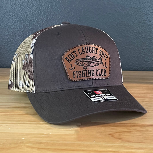 Ain't Caught Shit Fishing Club Leather Patch Trucker Hat. Richardson 112.